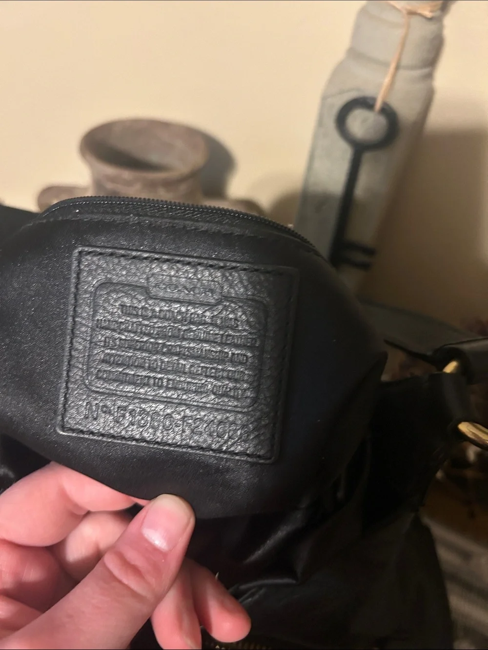 Coach Black Leather Shoulder Bag with Front Buckle Pocket and Gold Hardware